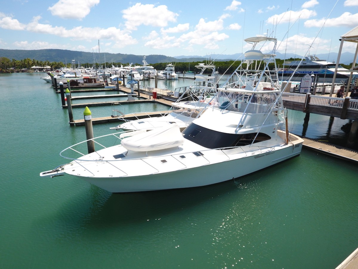 a boat is docked next to a body of water