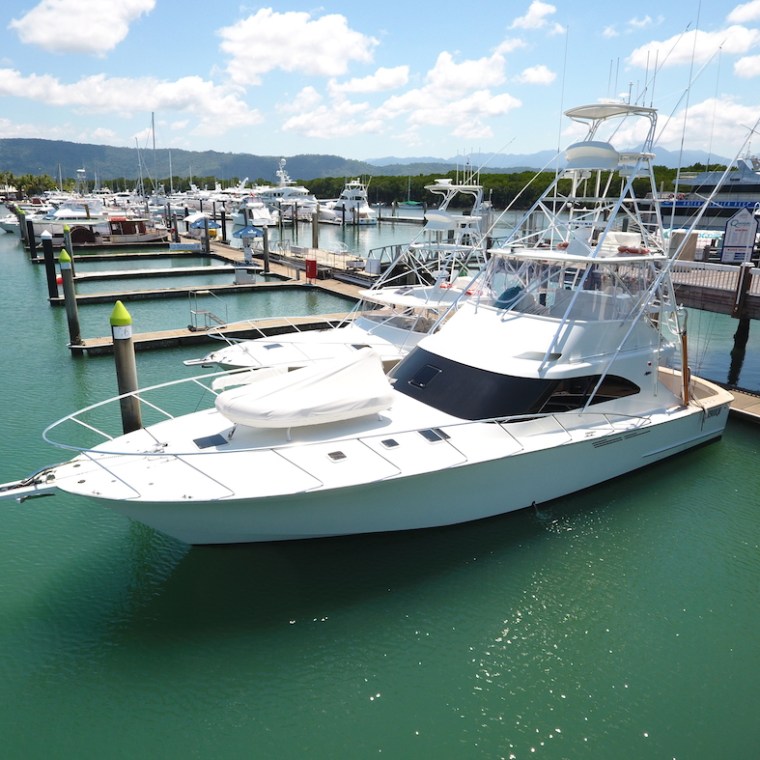 a boat is docked next to a body of water