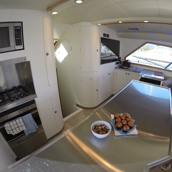 a kitchen with a sink and a mirror